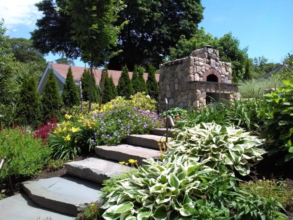 fine gardening and outdoor fireplace in the North Shore of Massachusetts